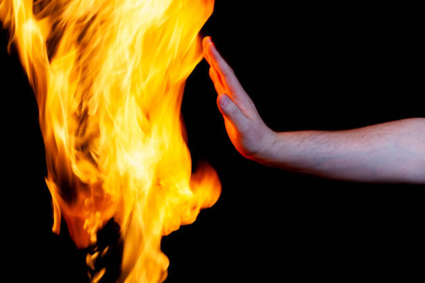 istock human hand and burning flame, use as a poster 1316905696