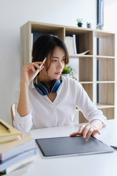 istock Female executive thinking over working schedule for employee writing report into digital laptop in coworking space. 1316905831