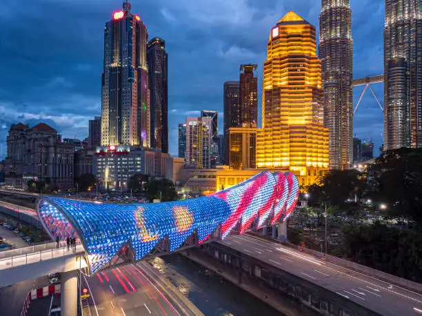 The link offers a seamless connection between Kampung Baru and Jalan Ampang, at a spot near KLCC.Saloma Link stretches for 370m, but the span that crosses the highway and river is 69m long.
walking around on 20 Feb 2020 a newly open Saloma Link bridge for public use ,capturing the image with drone aerial view that the bridge link to KLCC