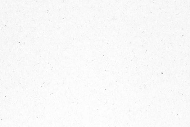 istock White paper or cardboard texture with black spot background. 1316910771