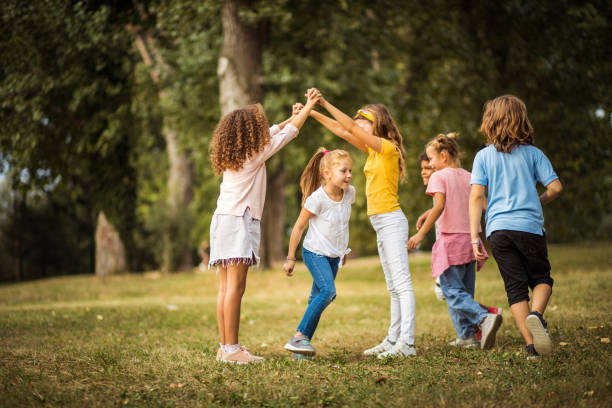 istock Large group of school kids having fun in nature. 1316911397