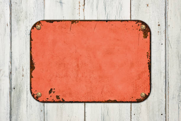Vintage red tin sign on a wooden background