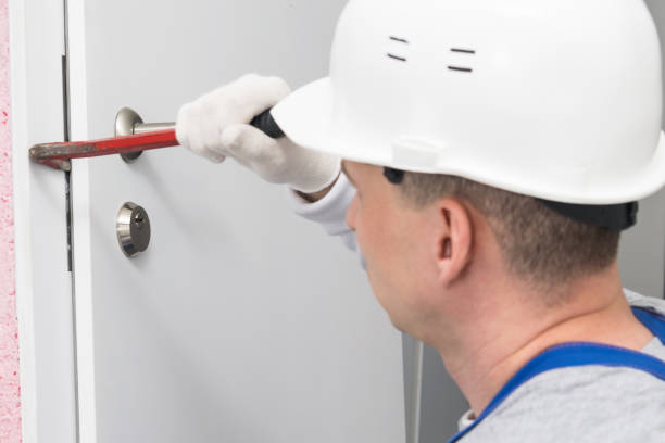 istock a construction worker in a helmet opens the front door with a special tool 1316913895