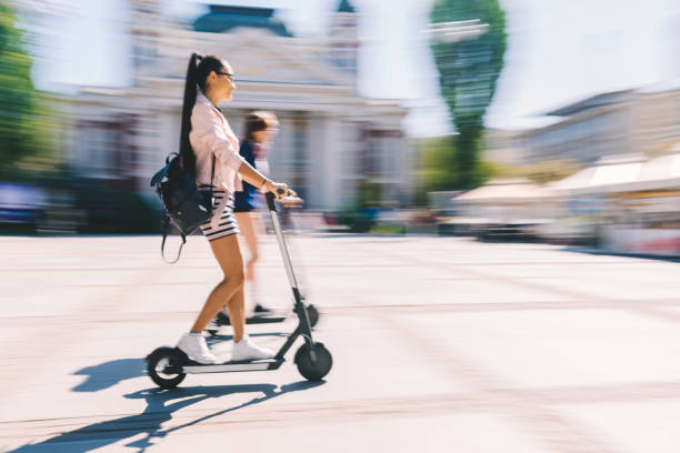 istock Tourists exploring the city on motor scooters 1316913925