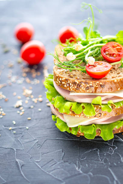 istock Traditional double sandwich on a dark background close-up, vertical. 1316917242