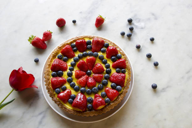 istock fruits cake decorated with berries on grey marble 1316917386