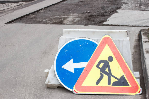 istock workers laying  hot asphalt on the road surface 1316921537