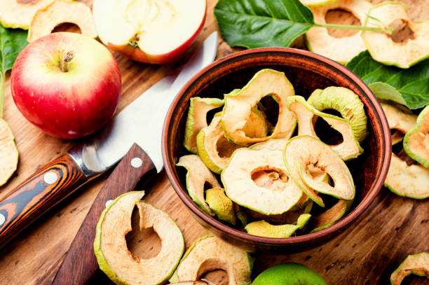 Apple chips with fresh apples stock photo