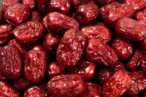 istock Jujube, Chinese dried red date fruit background 1316922381