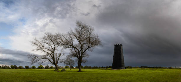 istock Black Mill with leafless treesat dawn in spring Beverley, UK. 1316922398