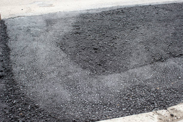 istock workers laying  hot asphalt on the road surface 1316926807