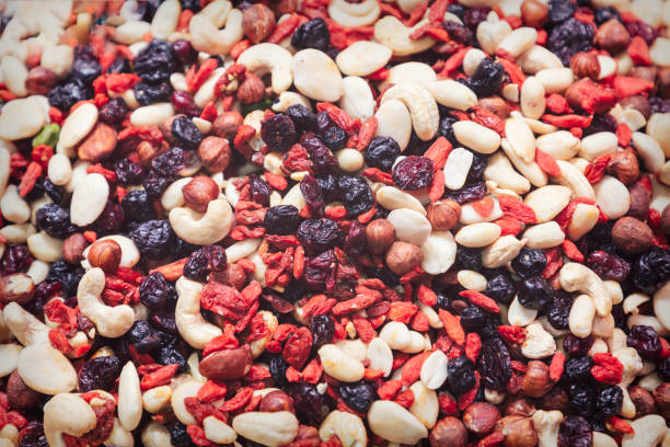 istock Mix of nuts, raisins and barberry for a quick bite (vintage photo effect) 1316927931