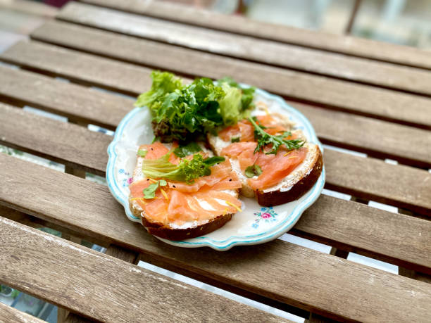 istock Sandwich, Toast with Smoked Salmon and Cream Cheese on White Plate. 1316928536