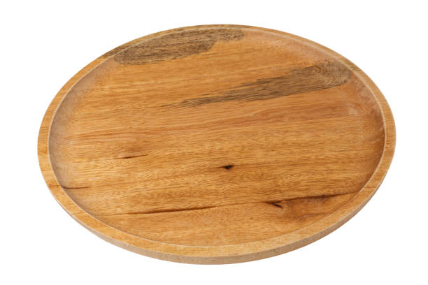 istock Round wooden plate isolated on white background, side view. 1316930832