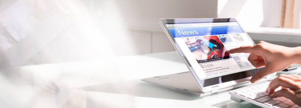 istock Watching News On Screen. Reading Newspaper Website 1316930844