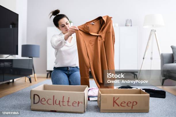 Woman Decluttering Clothes Sorting Stock Photo - Download Image Now - Closet, Messy, Organization