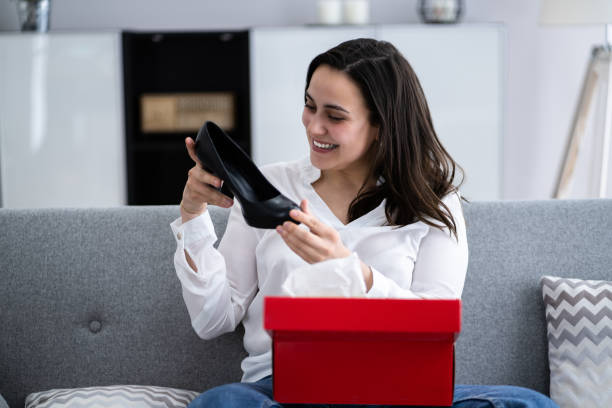 istock Woman Opening Parcel Gift Box 1316931890