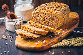 Homemade whole meal spelt bread with sunflower seeds and baking ingredients