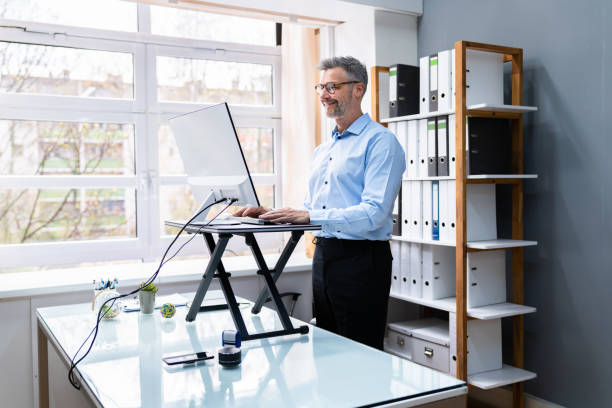 istock Large Version Of Adjustable Height Desk Stand In Office 1316933001