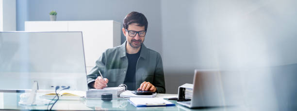 istock Accounting Tax Manager At Desk. Accountant 1316934277