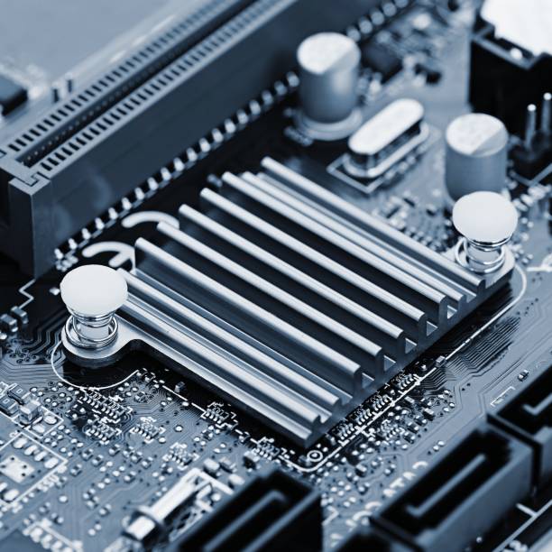 istock Components on board. PCB to PC. Chip, capacitor and connectors on the motherboard of a personal computer. Modern technological background. 1316936402