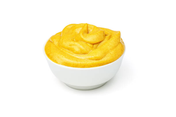 istock Mustard sauce in white ceramic bowl isolated on white background. 1316937616