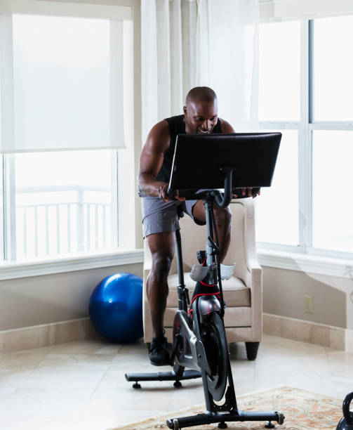 istock African-American man on exercise bike at home 1316937794
