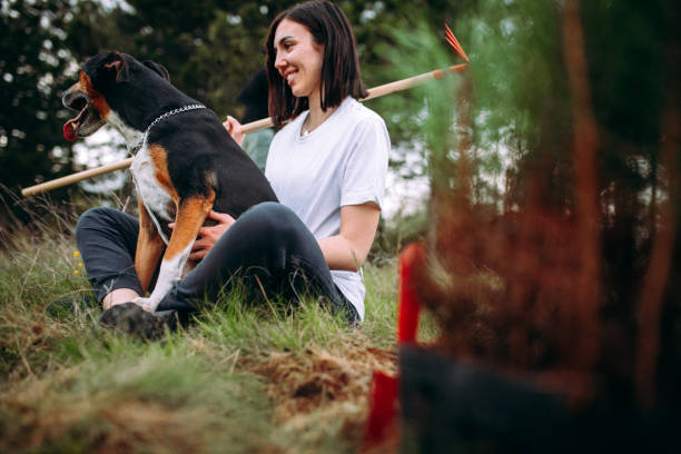 istock Female and happy dog plant coniferous tree 1316938635