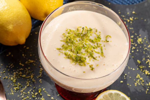 Lemon mousse in crystal bowl with lemon zest