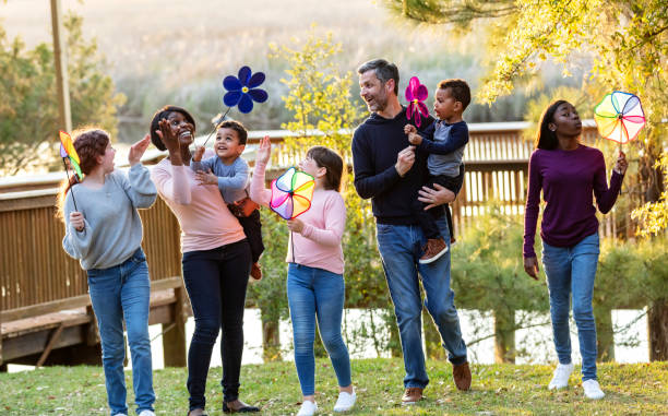 istock Blended family with five children playing at the park 1316939209