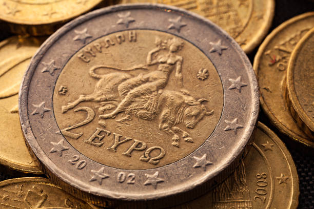 series of macro shots of euro coins. reverse of 2 euro coin. year of manufacture 2002. country greece - year 2002 imagens e fotografias de stock