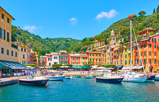 Portofino, Italy - July 1, 2019: Harbour vith boats in Portofino - famous resort on the Italian riviera in Liguria