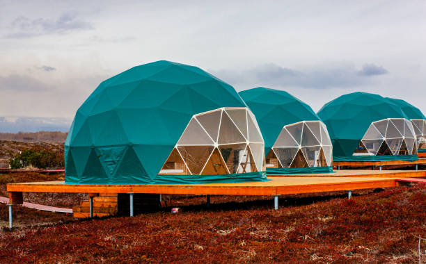 Green geo-dome tent on Kamchatka. Cozy, camping, glamping, holiday, vacation lifestyle concept. Green geo-dome tent on Kamchatka peninsula. Cozy, camping, glamping, holiday, vacation lifestyle concept. Outdoors cabin, scenic background glamping photos stock pictures, royalty-free photos & images