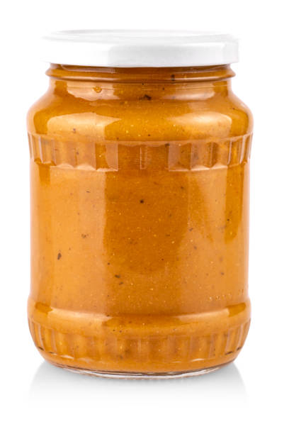 istock glass jar with squash caviar on white background 1316951505