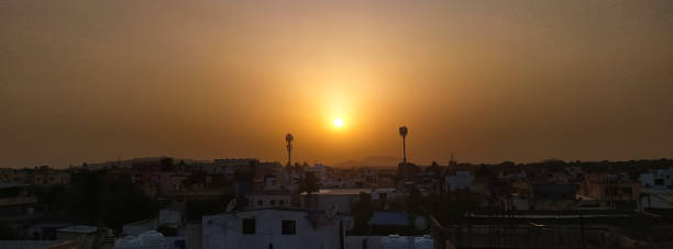 istock Sundown in two towers at horizon cityscape 1316951720