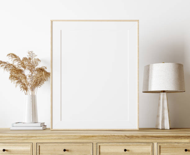 istock Modern interior design in natural colors with dry plants decoration and empty white mock up picture frame 1316958211