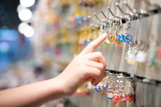 istock Child's hand choosing glass miscellaneous goods 1316958412
