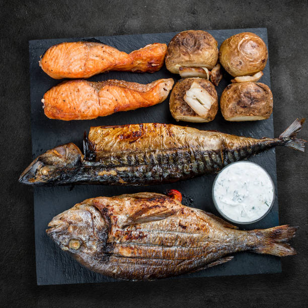 istock Assorted delicious grilled meat on a stone board. Top view 1316958819