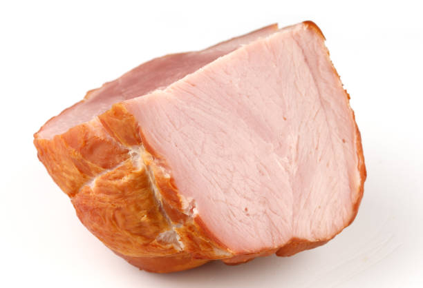 Studio shot of sliced Lomo, air dried Spanish pork loin with paprika and garlic cut out against a white background