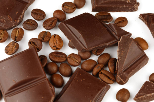 istock Pieces of chocolate and coffee beans on a white isolate background 1316960938