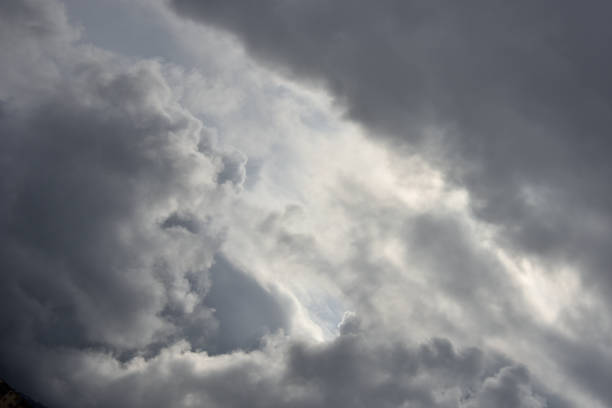 istock agglomerations of clouds torn by the rays of the sun 1316962734