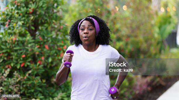 Senior Africanamerican Woman Exercising Outdoors Stock Photo - Download Image Now - Senior Adult, Power Walking, Jogging