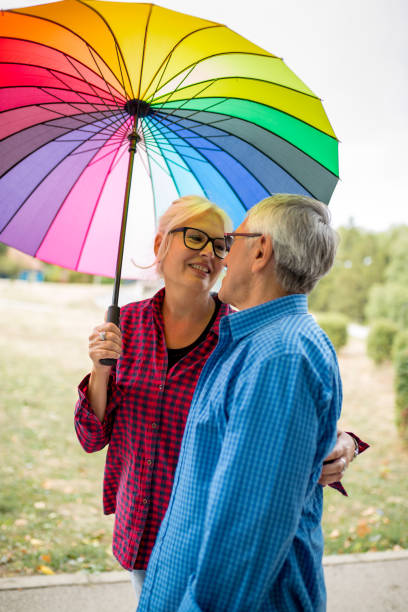 istock Couple walking in wet day 1316965990