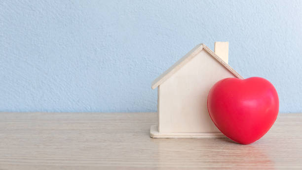 istock A house model and red heart love on table with copy space. 1316967415