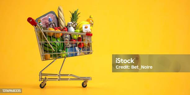 Shopping Cart Full Of Food On Yellow Background Grocery And Food Store Concept Stock Photo - Download Image Now