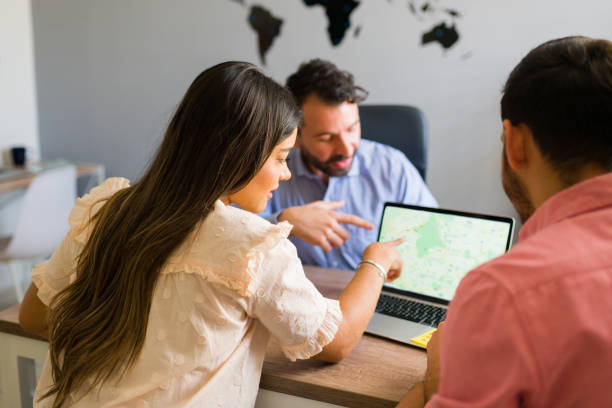 istock Choosing our holiday trip with a travel agent 1316969948
