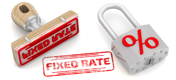 Rubber stamp and red imprint FIXED RATE and a padlock with red percent symbol lies on a white surface. 3D illustration