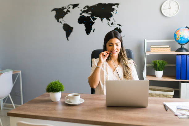 istock Travel agent taking a business call at the office 1316971101
