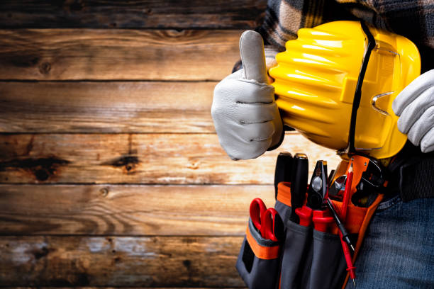 istock Electrician technician with tool belt on rustic wooden background. Electricity. 1316972735