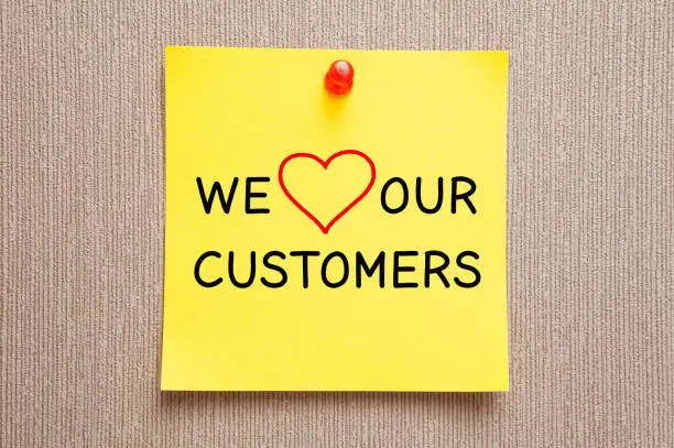 Photo of We Love Our Customers Sticky Note Concept